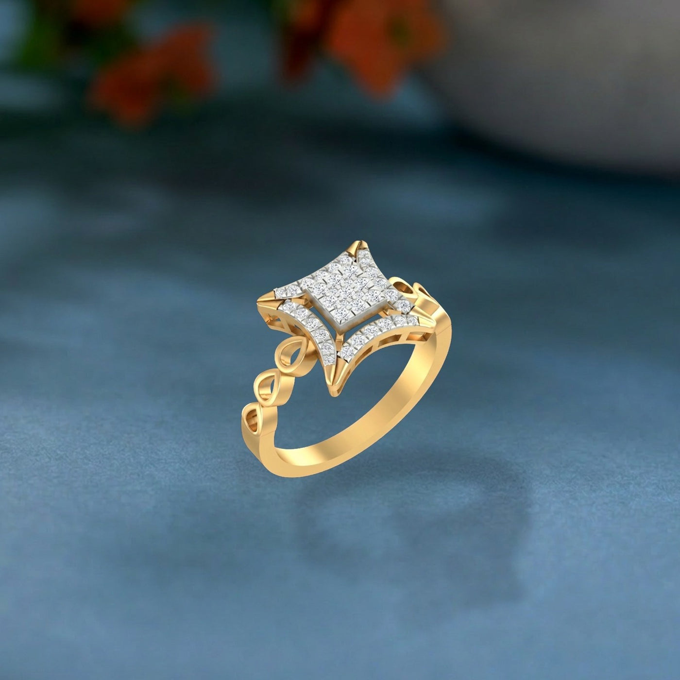Gold ring with diamond accents on a dark blue background