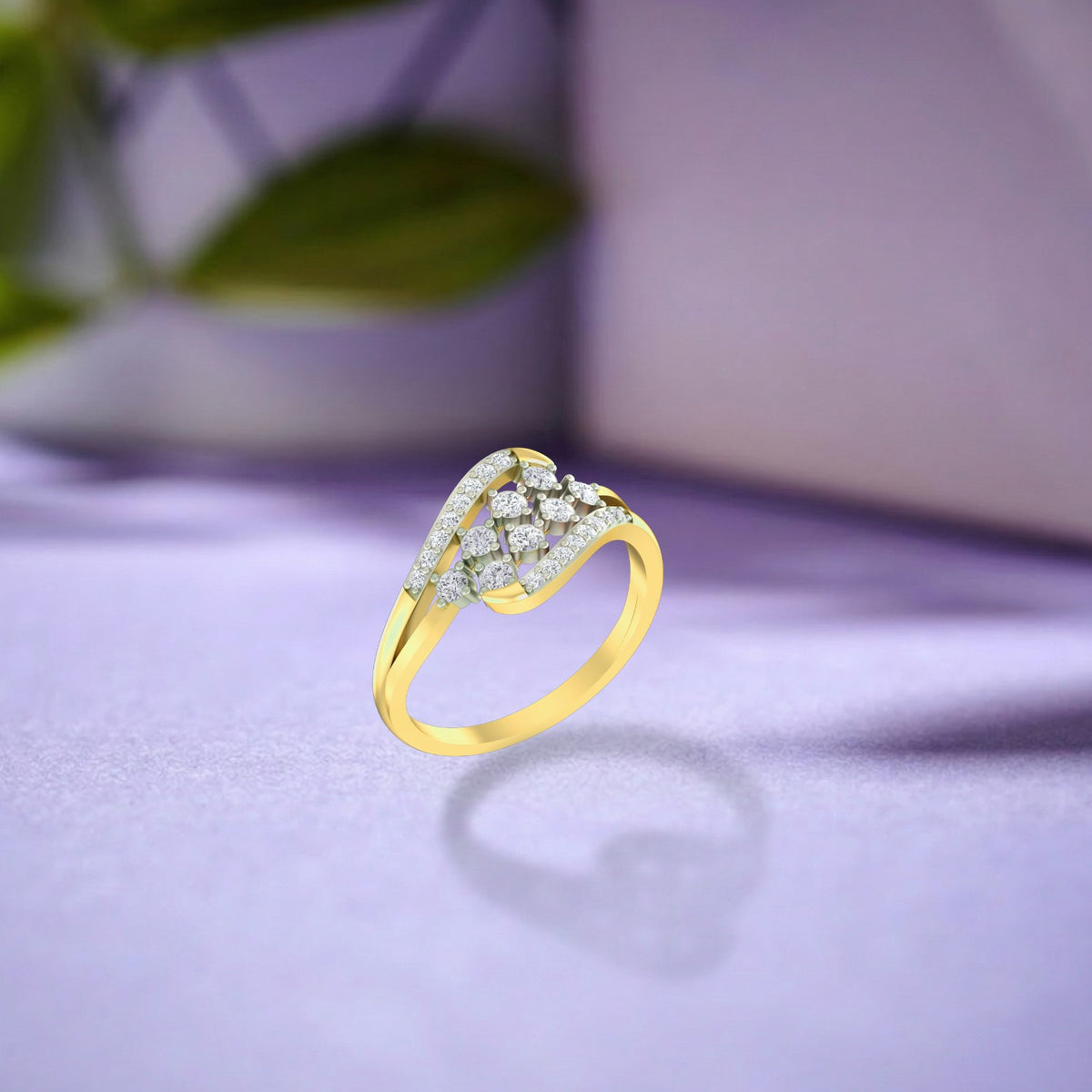 A gold ring with a pavé-set diamond cluster, on a soft lavender surface with a blurred background.