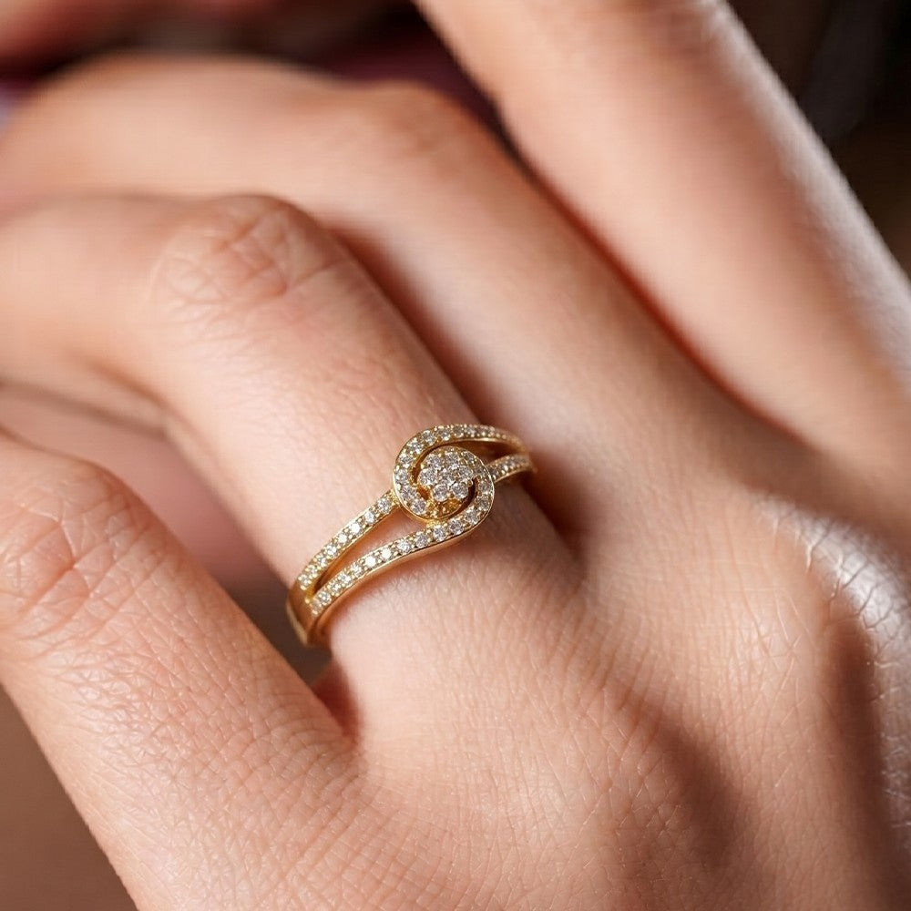 Gold ring with diamonds on a person's finger