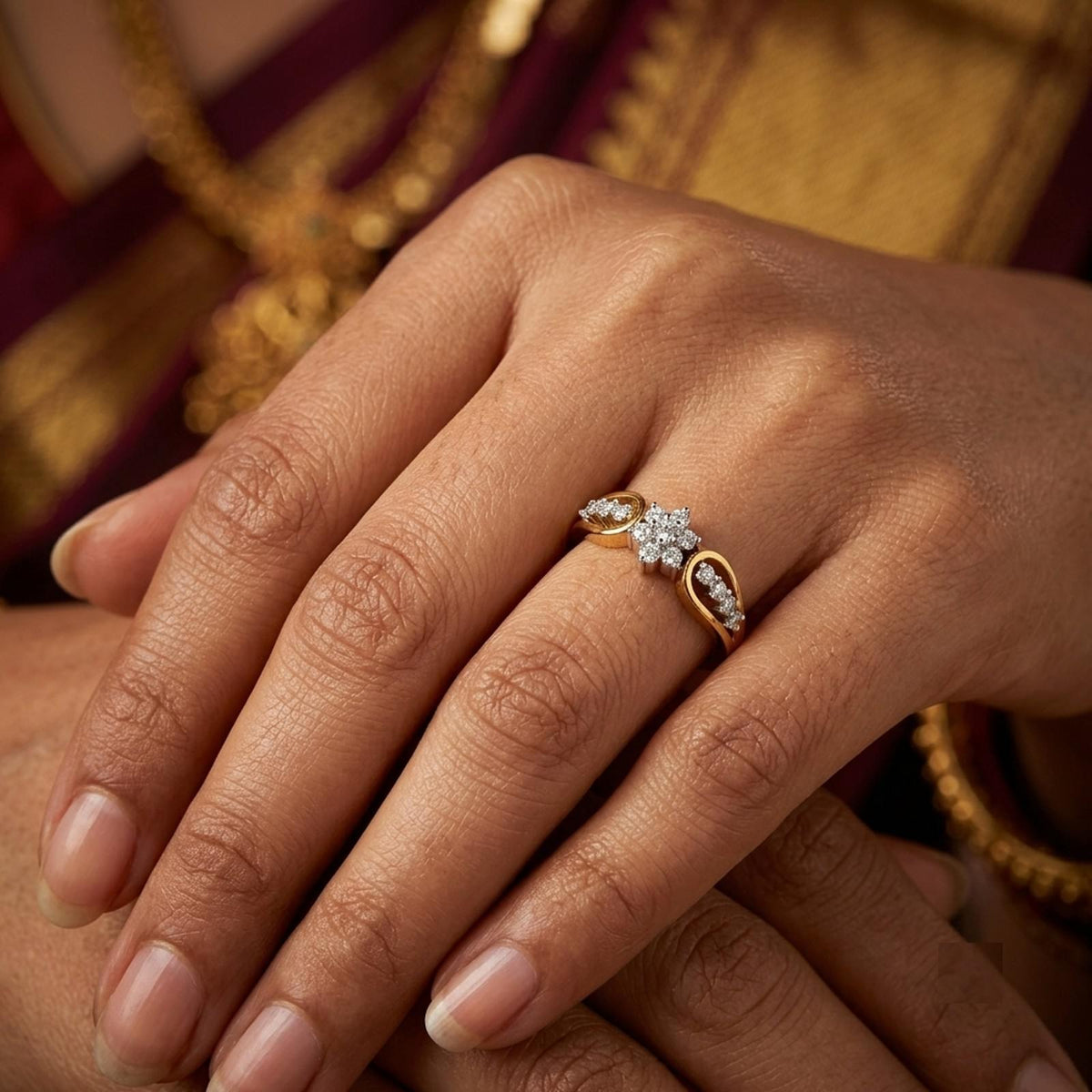 Close-up shot of a gold and diamond with floral design.