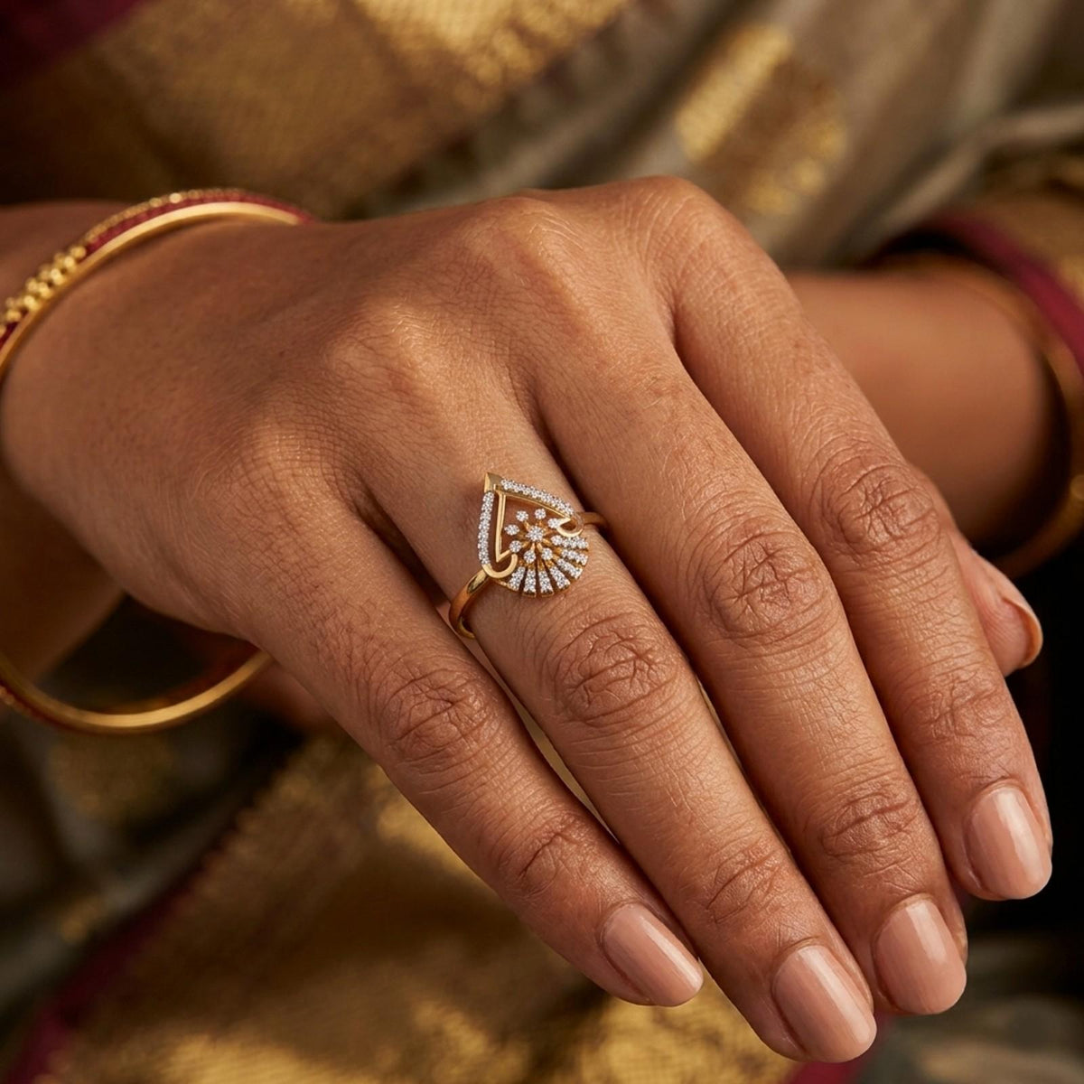Gold ring with diamond accents on a person's finger