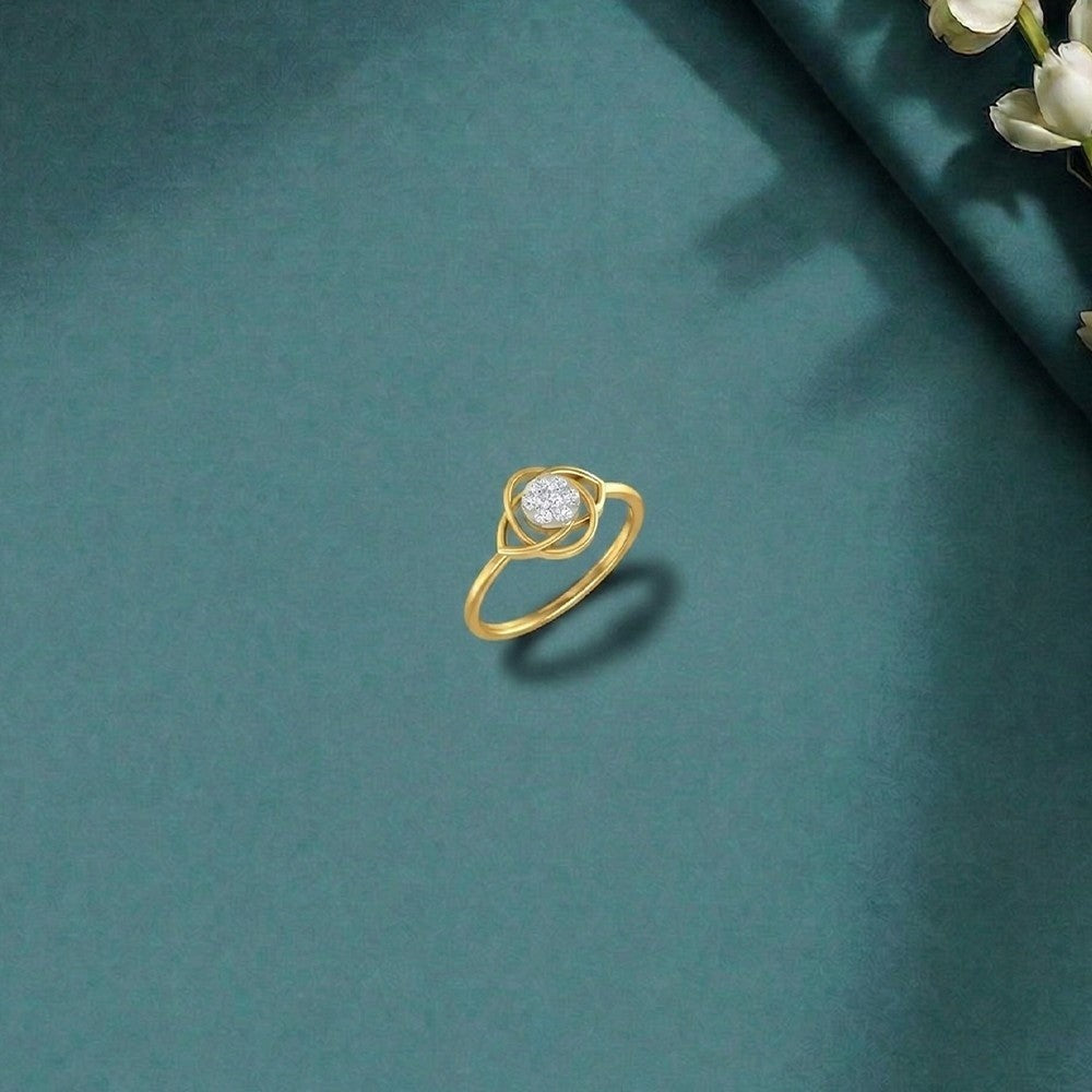 Gold and diamond with floral design on a teal surface
