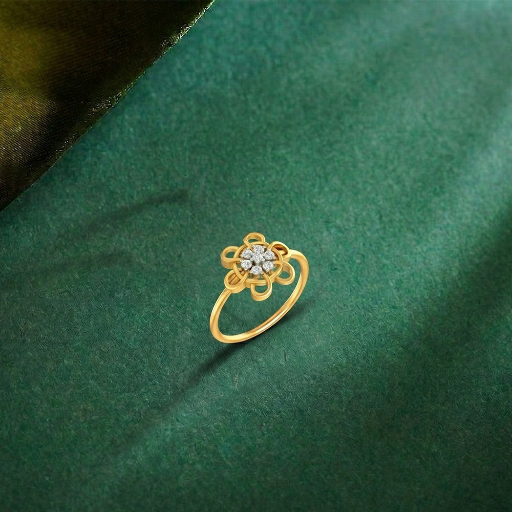 Gold and diamond with floral design on a green surface.