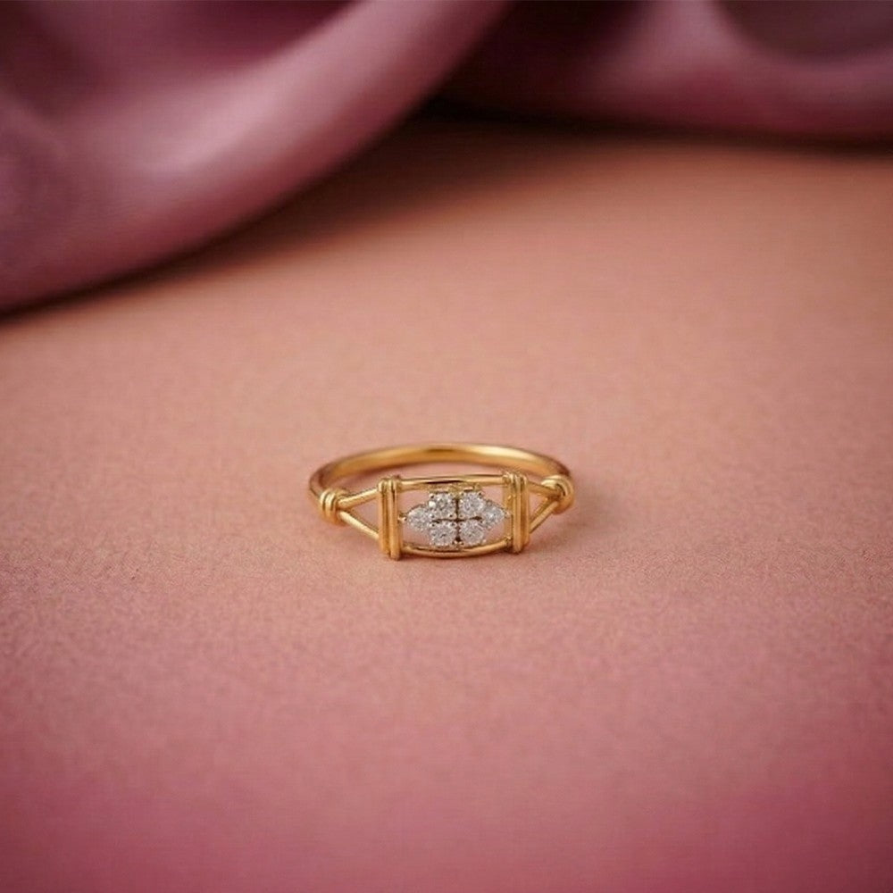 Gold and diamond with cluster setting on a pink surface.