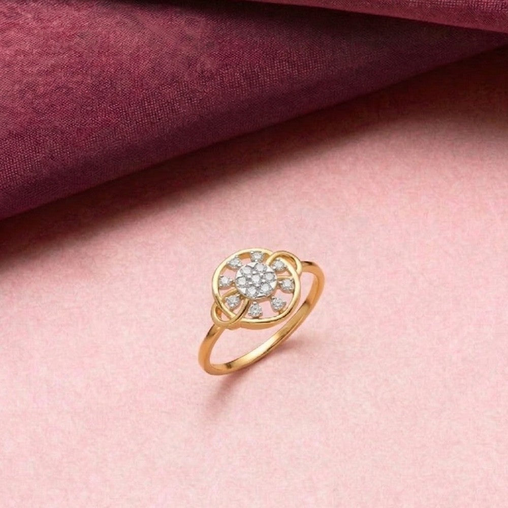Gold ring with gemstones on a pink fabric background