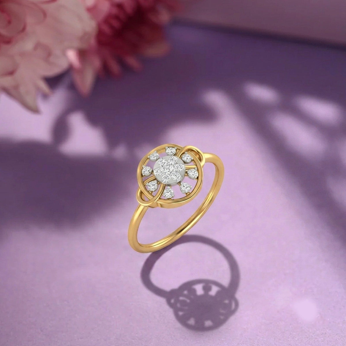 Gold ring with cluster setting on a pink fabric background
