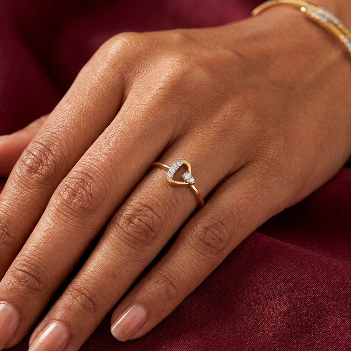 Close-up shot of a gold and diamond women's ring.