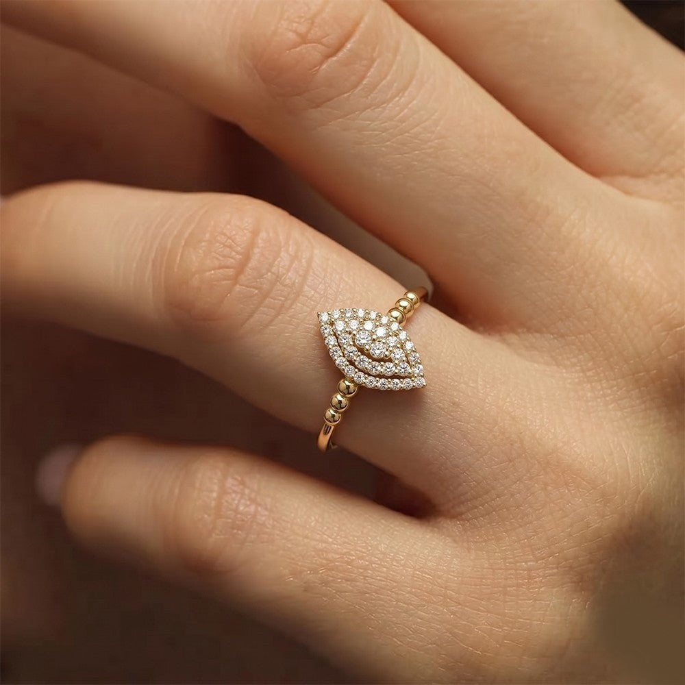 Close-up shot of a gold and diamond with cluster setting.