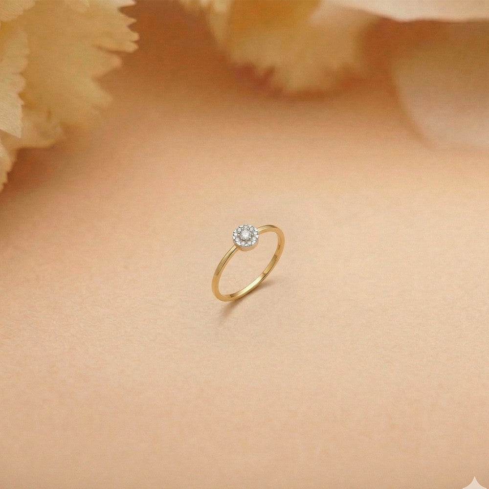 Gold and diamond with cluster setting on a brown surface.