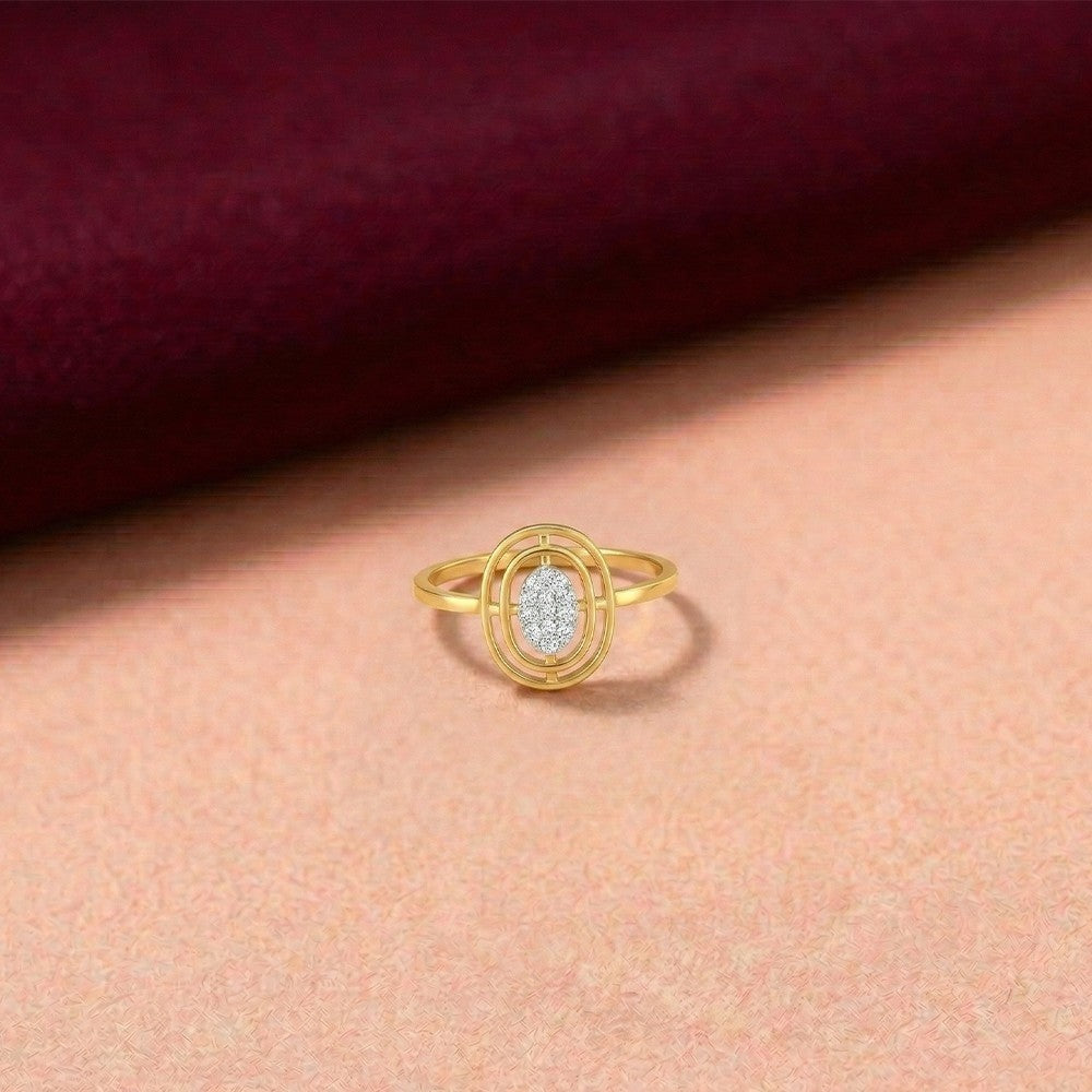 Gold and diamond with cluster setting on a pink fabric background