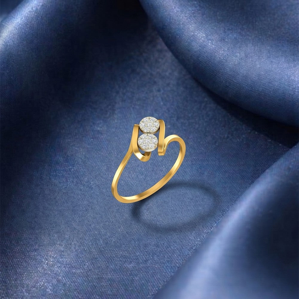 Gold ring with diamond accents on a blue fabric background