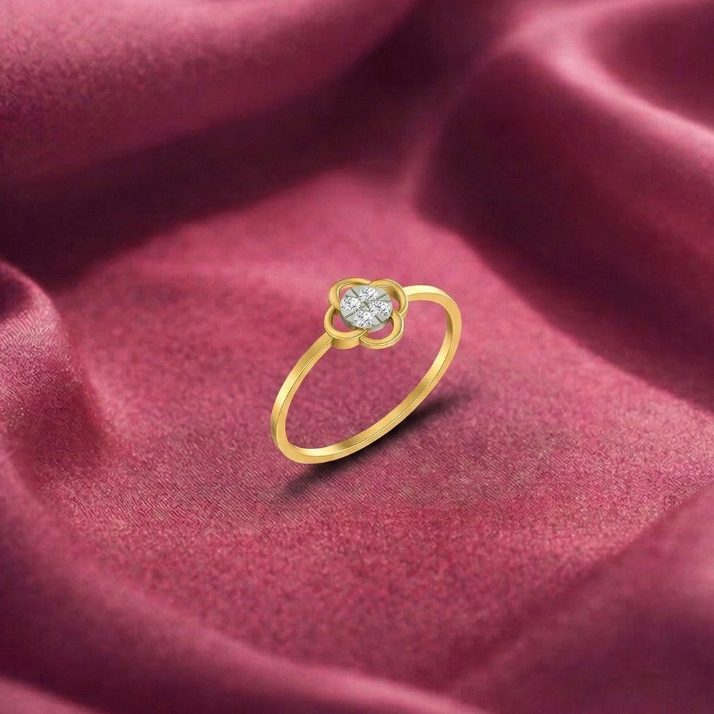 Gold and diamond with floral-design and cluster setting on a red fabric surface.