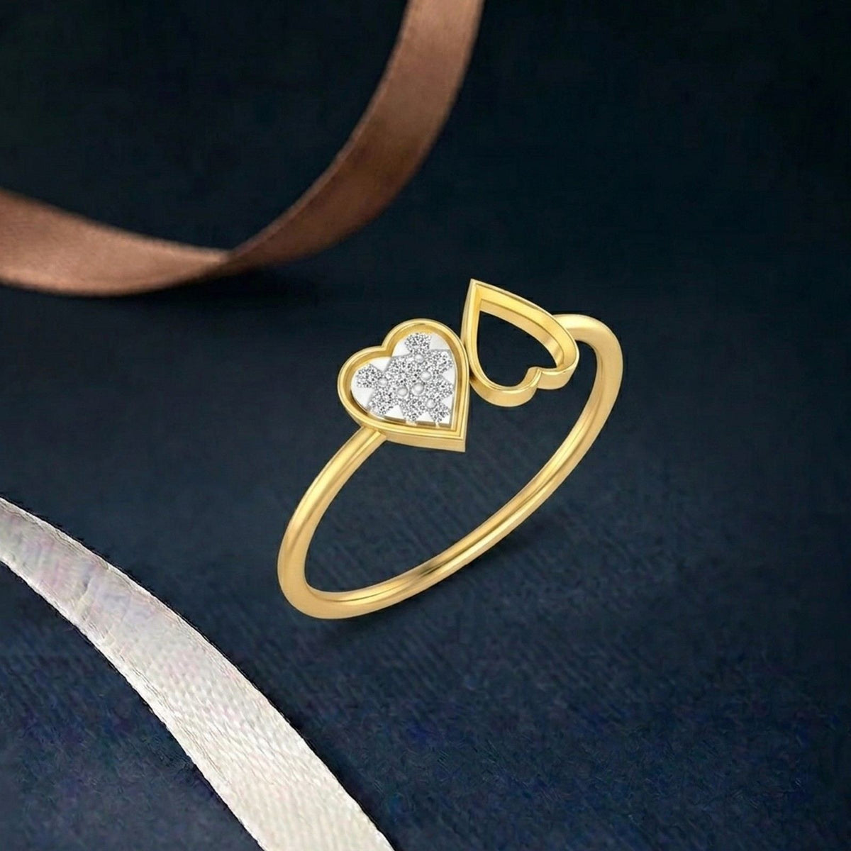 Gold and diamond with heart-shaped cluster setting on a teal surface.