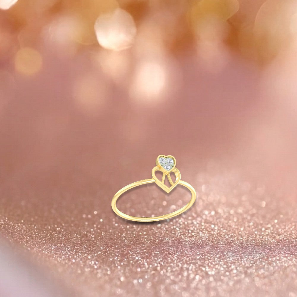 Gold and diamond with heart-shaped cluster setting on a pink surface.