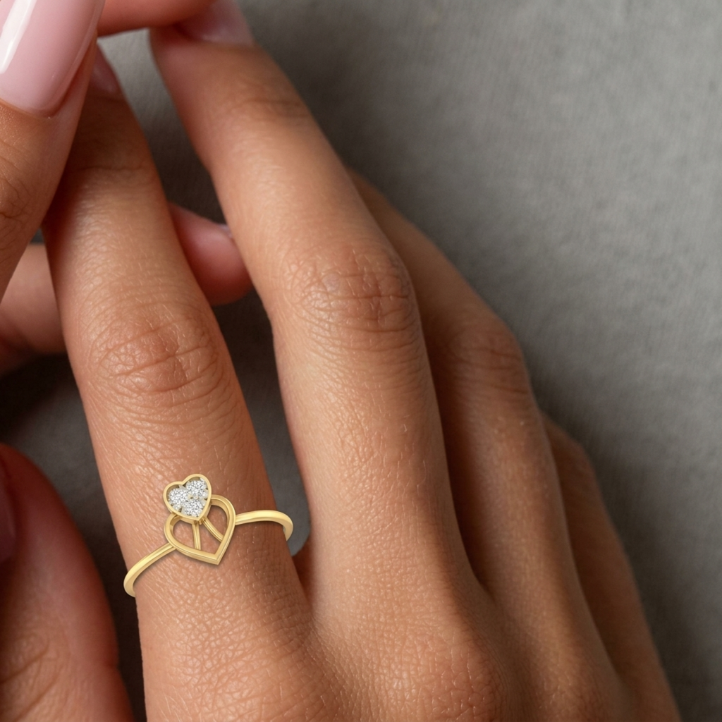 Gold and diamond with heart-shaped cluster setting on a person's finger.