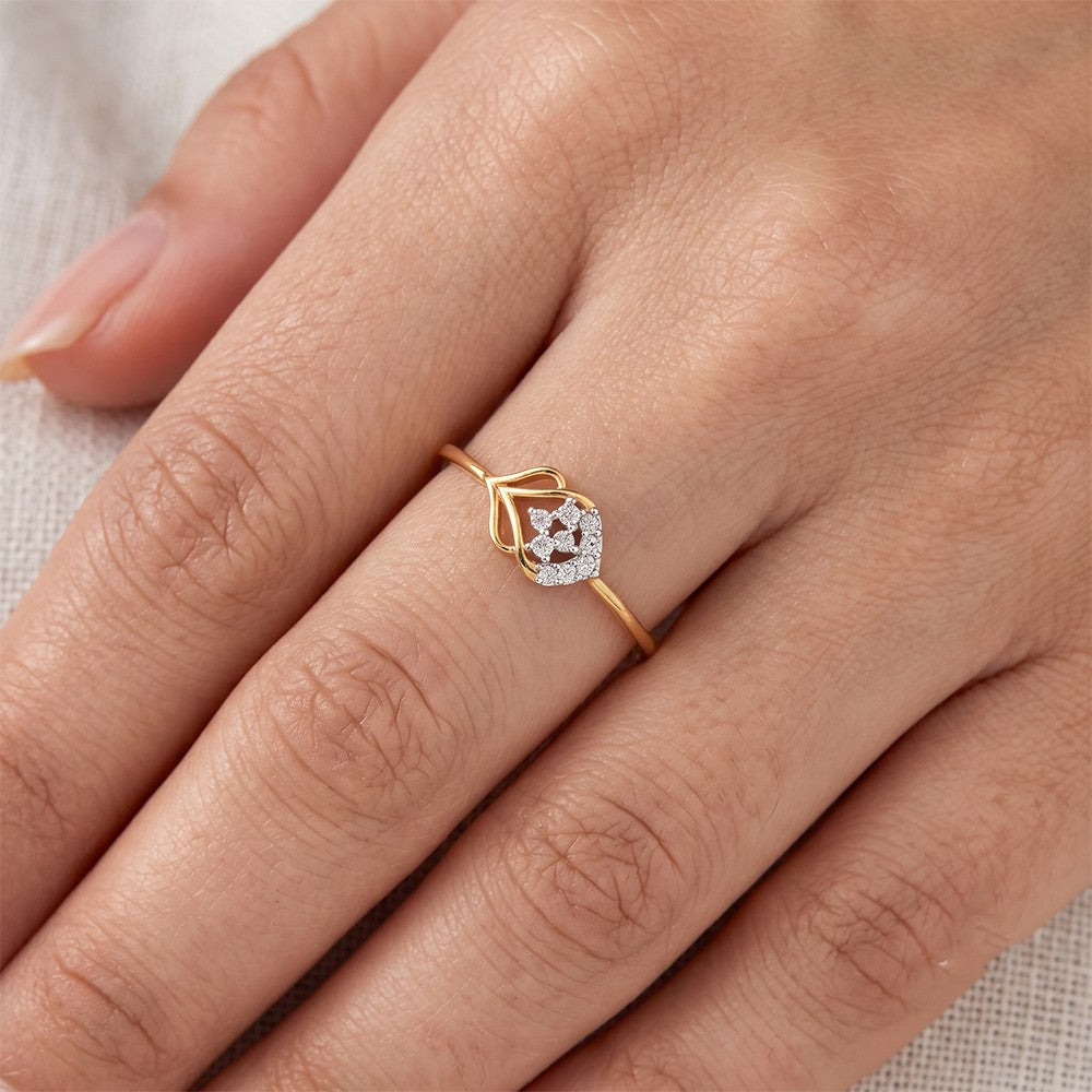 Close-up shot of a gold and diamond with cluster setting women's ring.