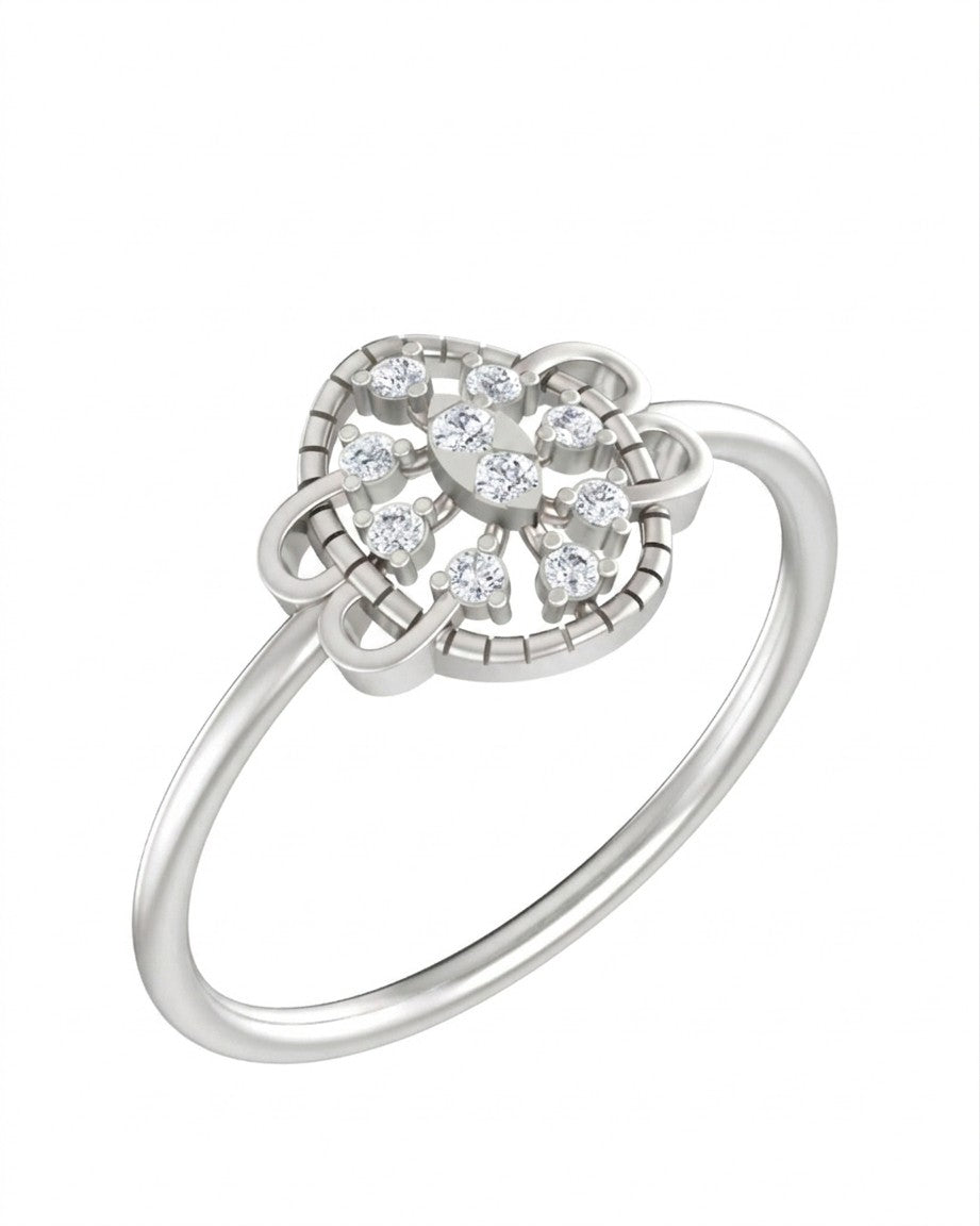 A white gold ring with a floral-design cluster, set against a plain white background.