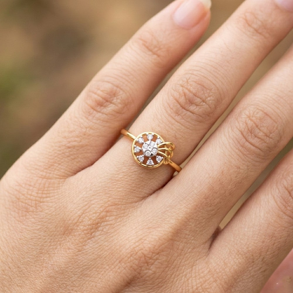 Gold ring with a diamond on a person's finger against a blurred background