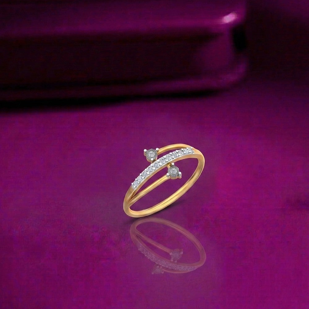 Gold and diamond half-eternity ring on a reflective surface.
