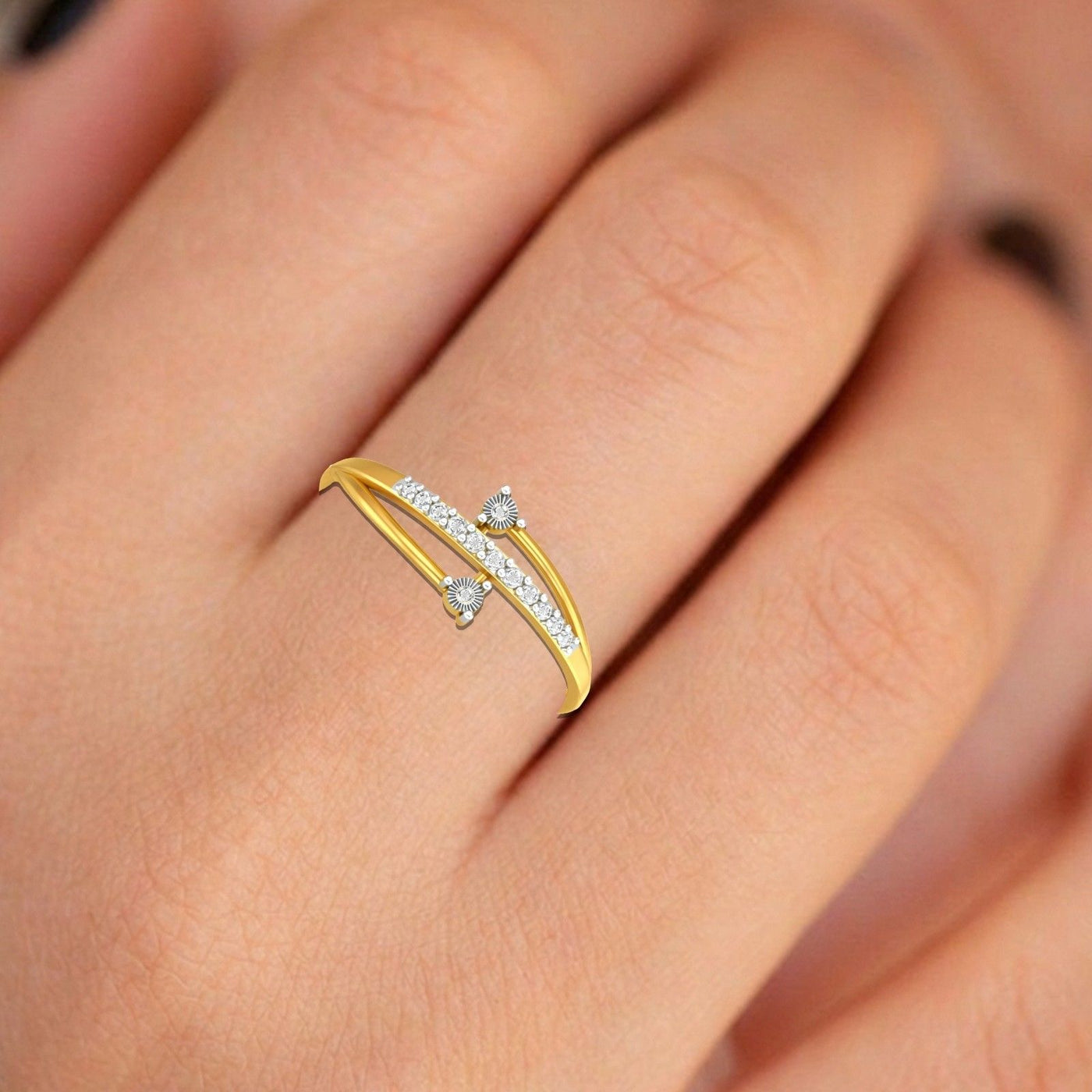 Close-up shot of a gold and diamond half-eternity ring.
