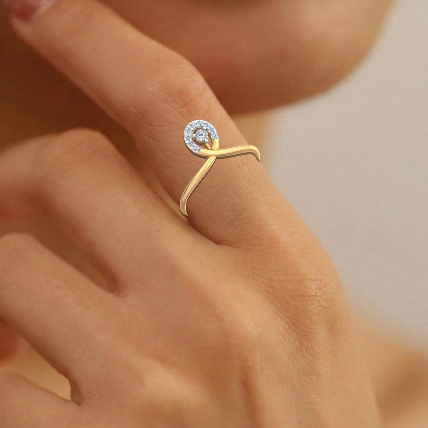 Close-up shot of a  gold and diamond women's ring