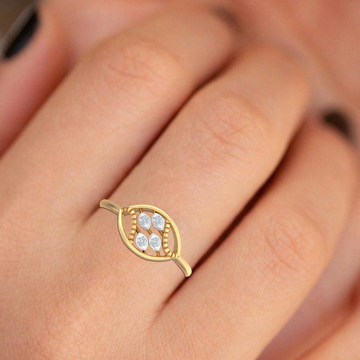 Gold and diamond women's ring on a person's finger.