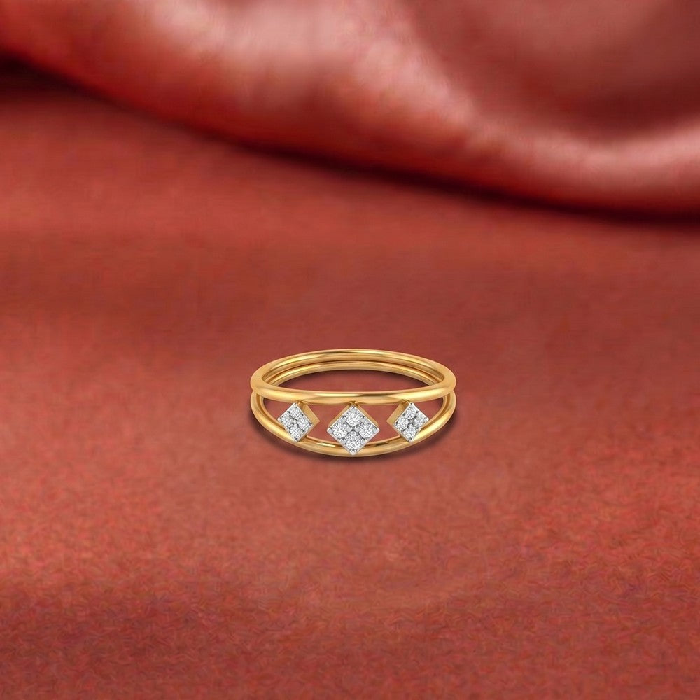 Gold ring with diamonds on a red fabric background