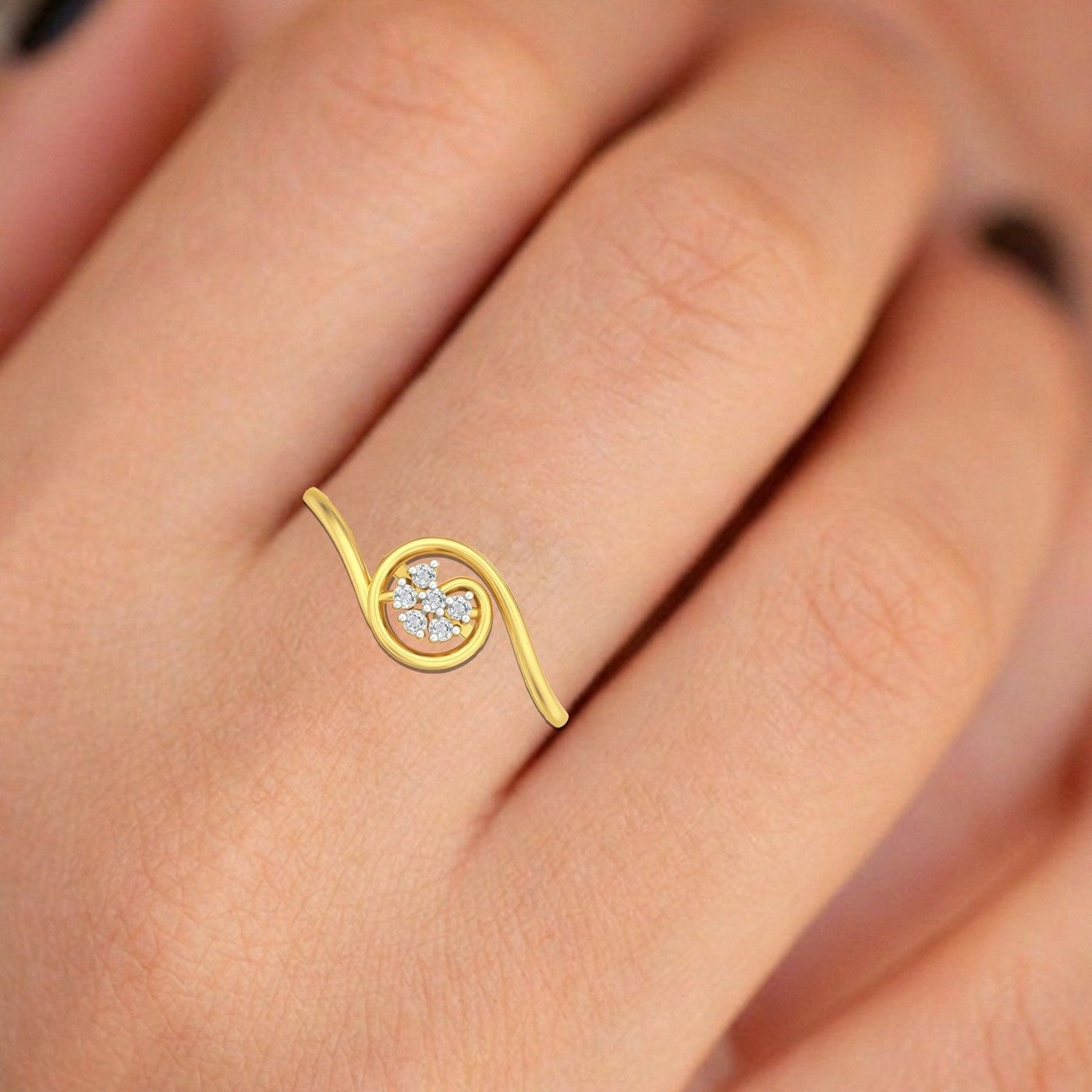 Gold ring with a floral-shaped diamond on a hand