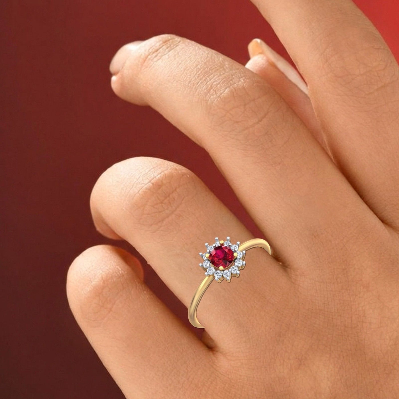 Close-up shot of a gold and diamond with ruby gemstone setting ring.