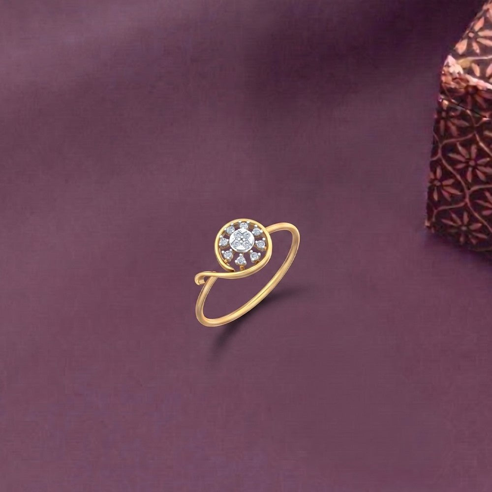 Gold and diamond with cluster setting on a purple surface. 