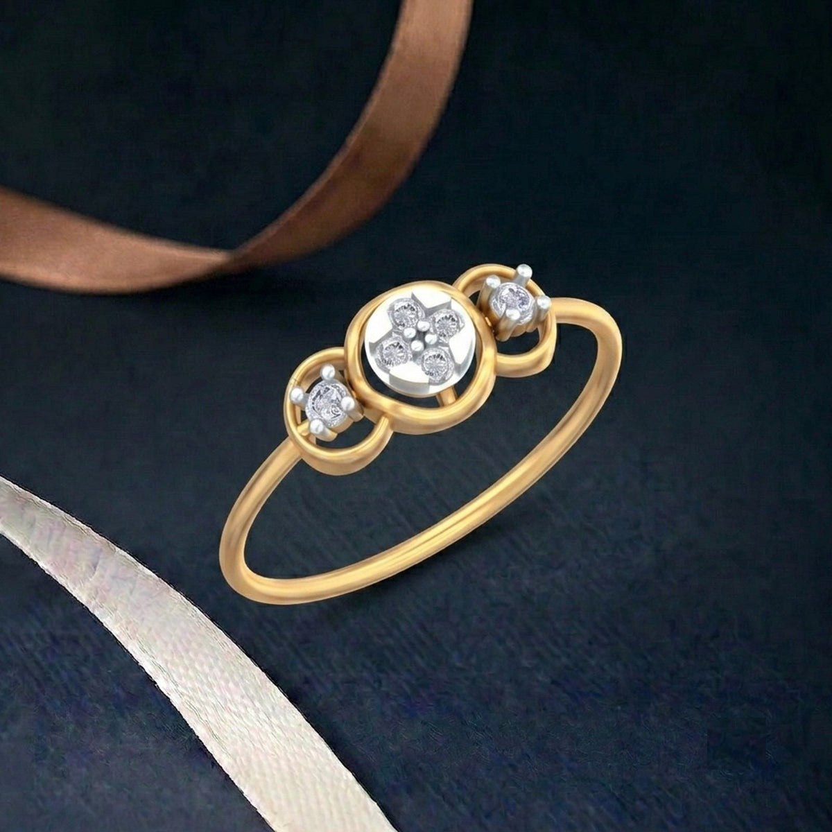 Gold ring with diamonds on a dark blue fabric background