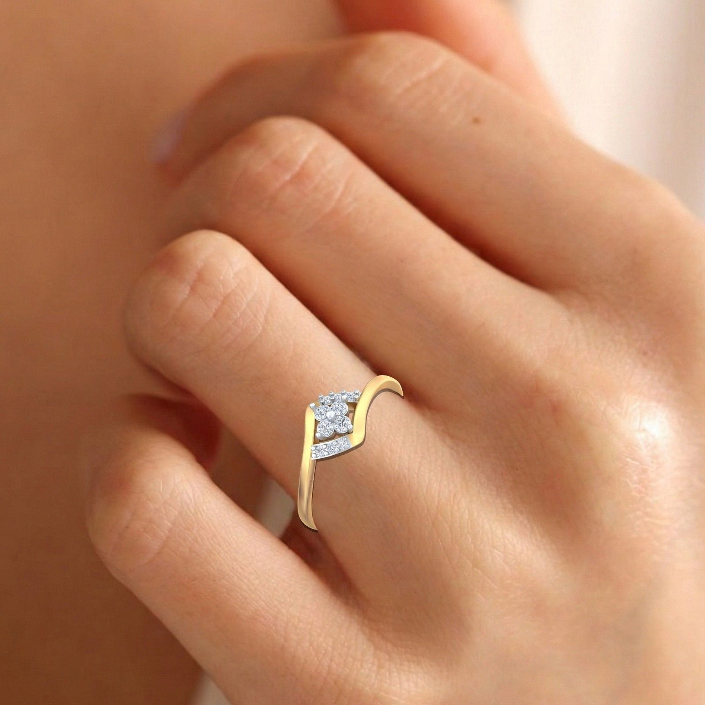 Gold ring with diamonds on a person's finger