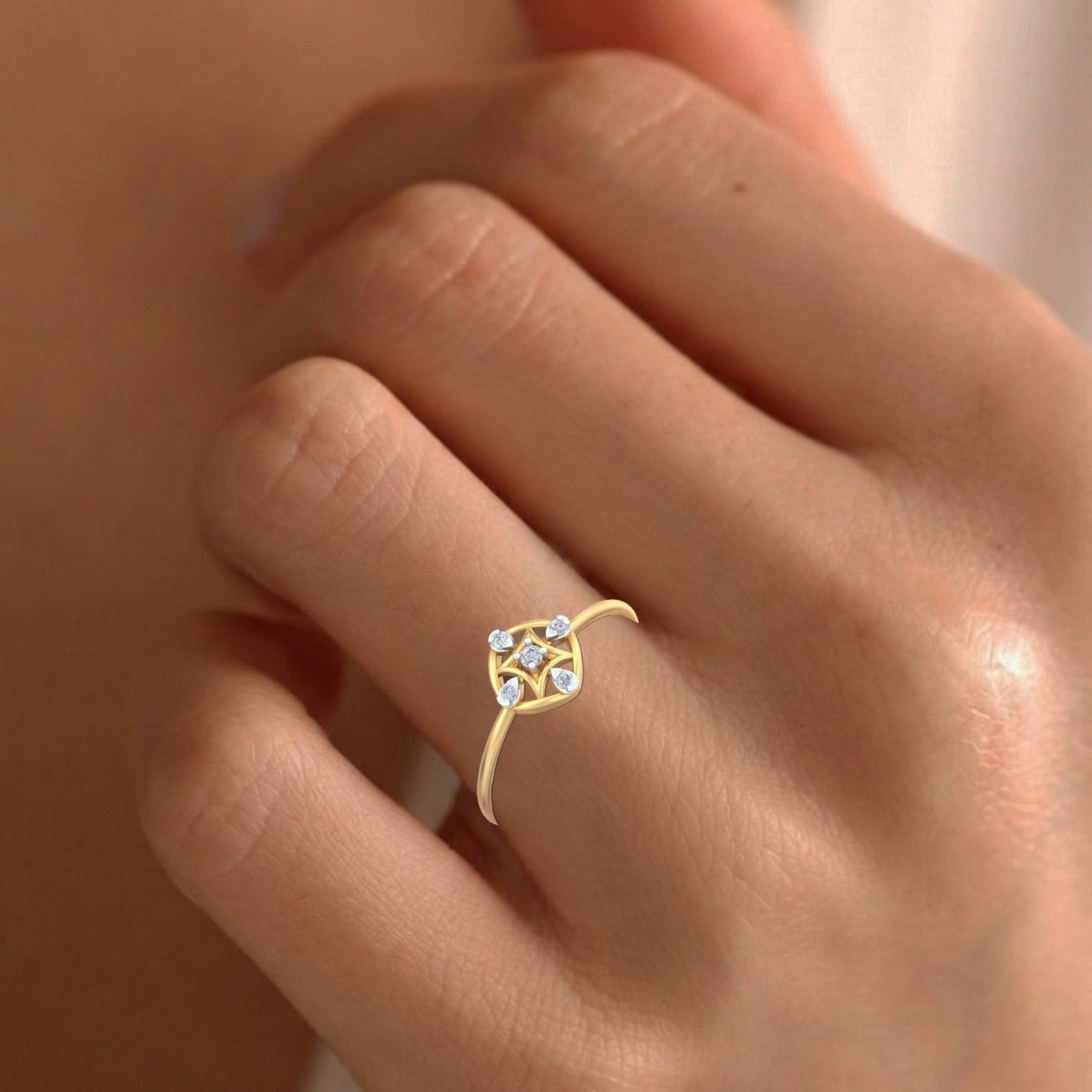 Gold ring with small diamonds on a person's finger