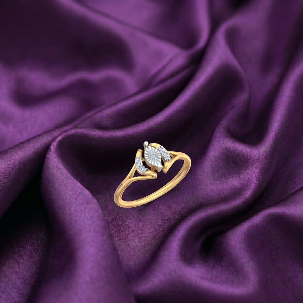 A gold ring with a sunburst diamond setting, displayed on draped purple satin fabric.
