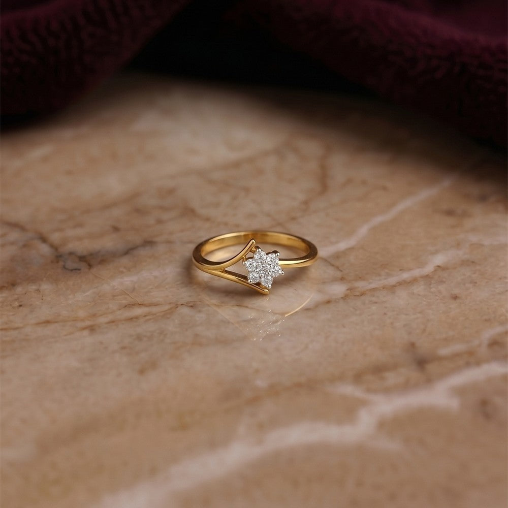 Gold and diamond with floral cluster on a beige surface.