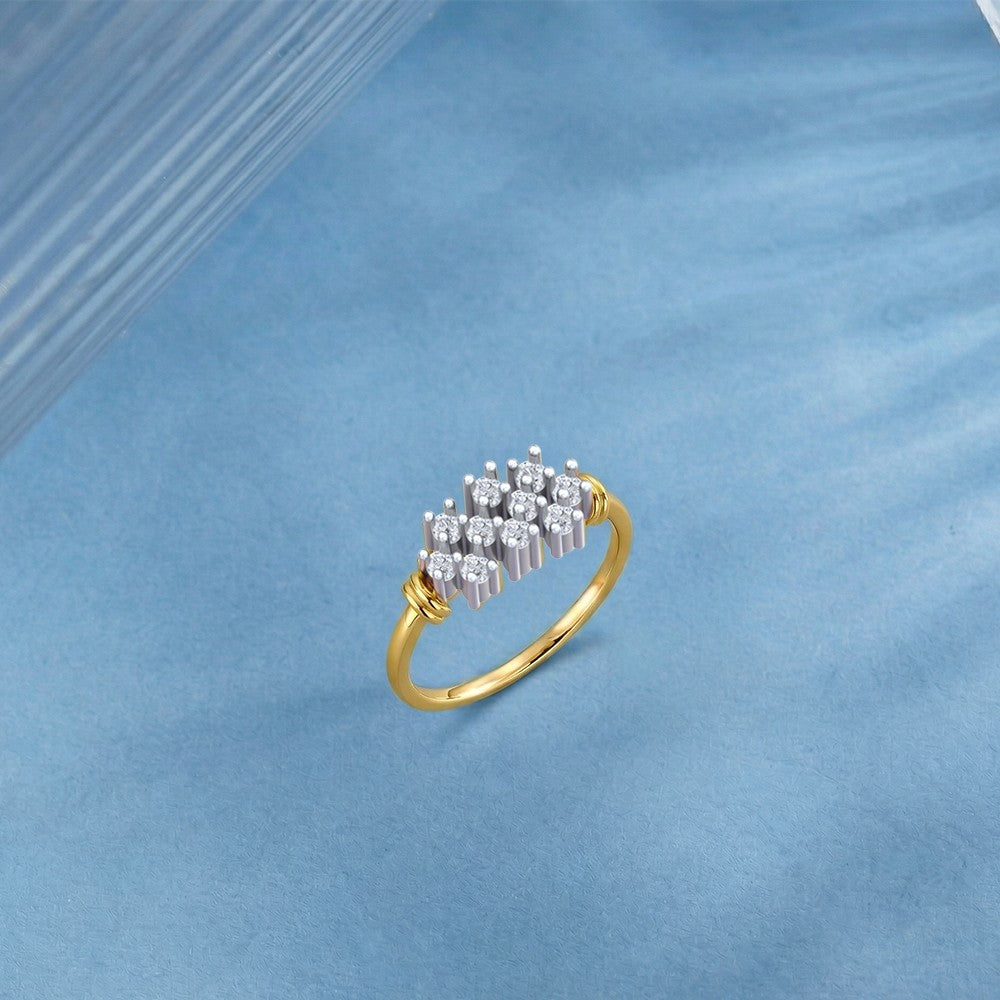 Gold and diamond with cluster setting on a blue surface.