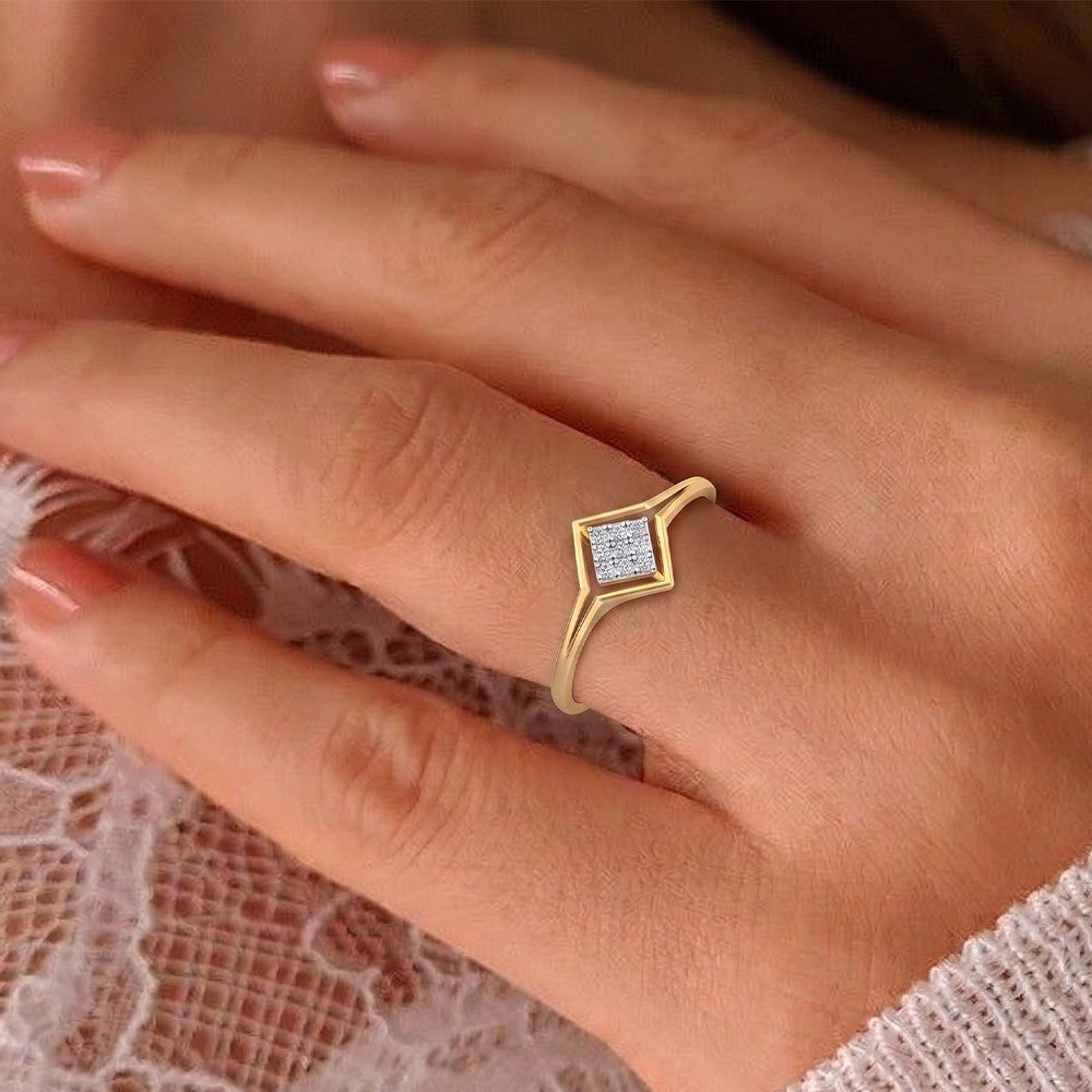 Close-up shot of a gold and diamond with cluster setting women's ring.