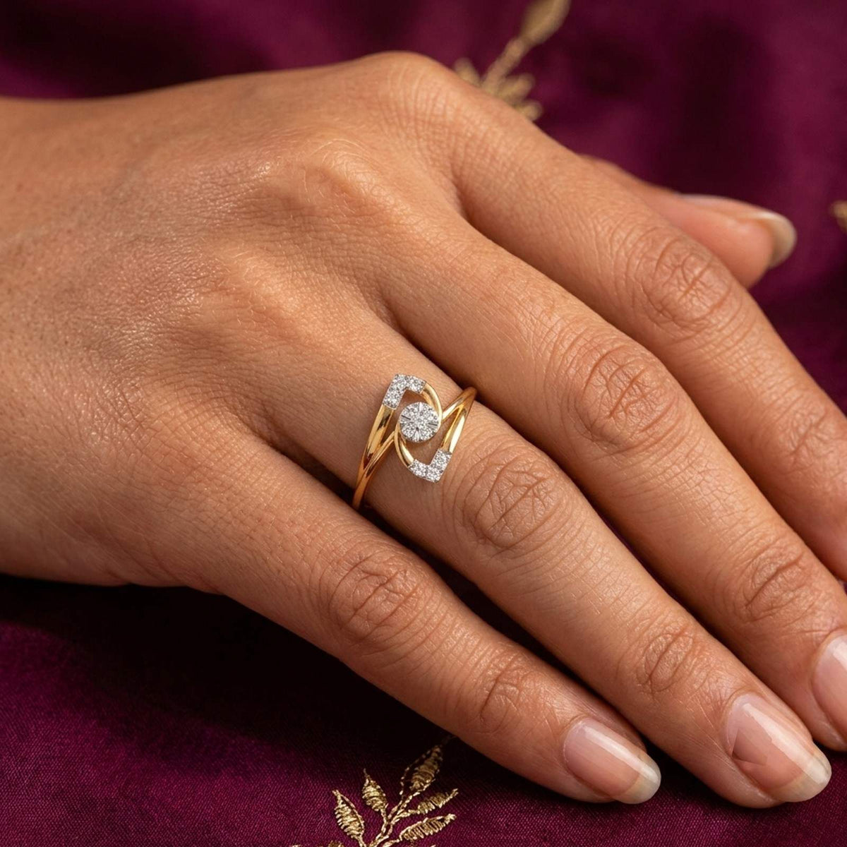 Close-up shot of a gold and diamond with cluster setting ring.