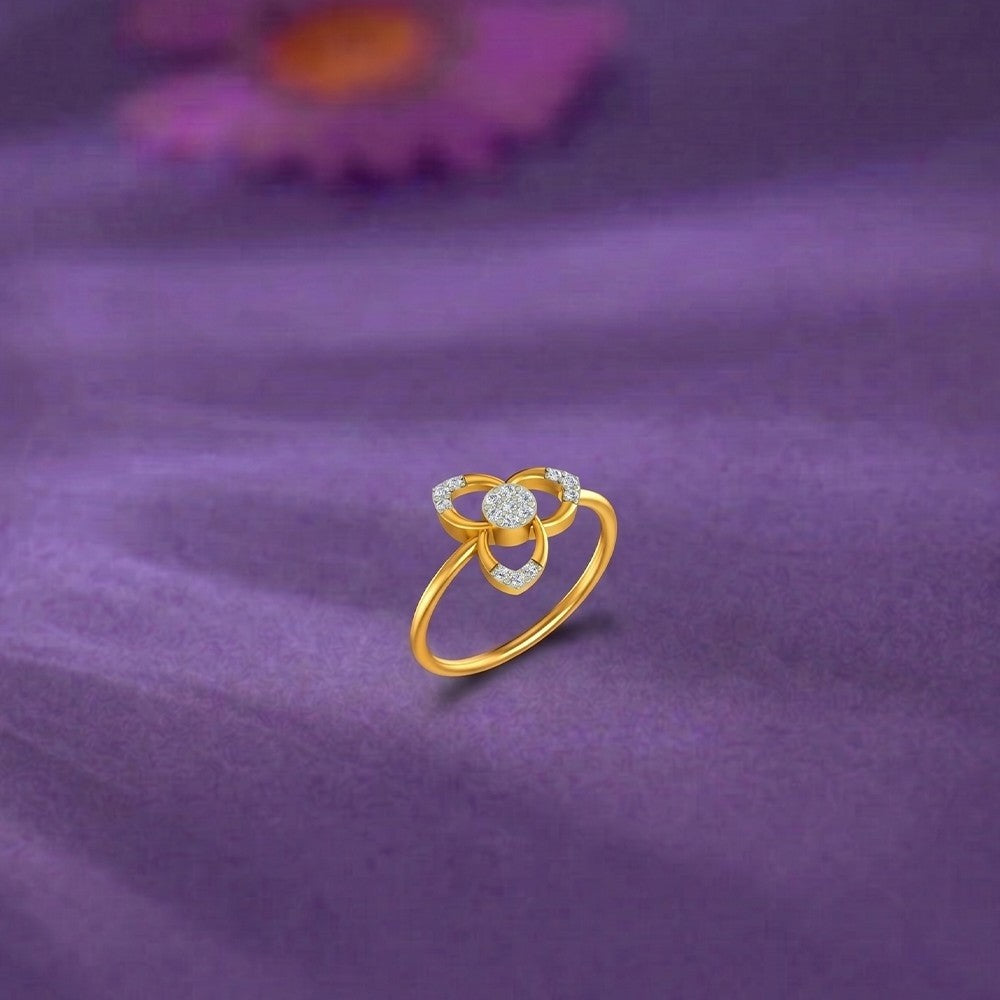 Gold and diamond with floral design on a purple surface.