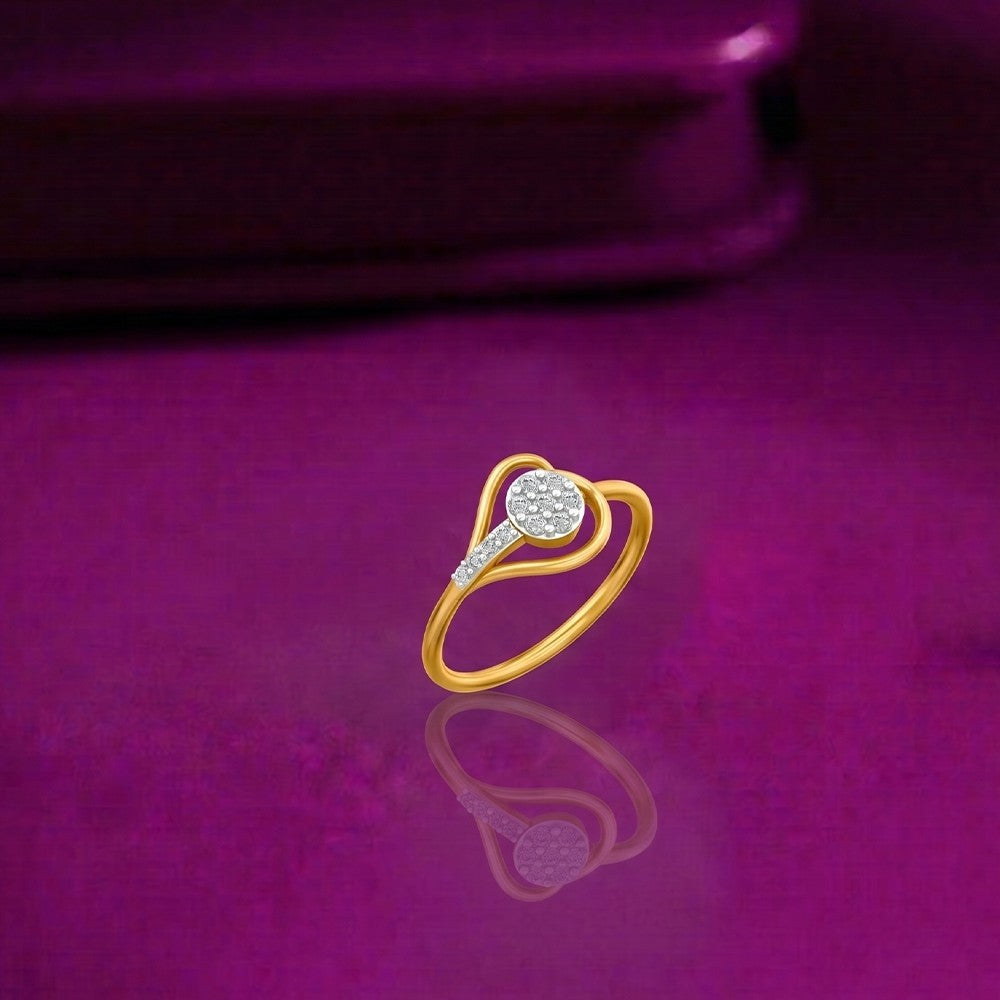 Gold ring with a diamond on a purple surface