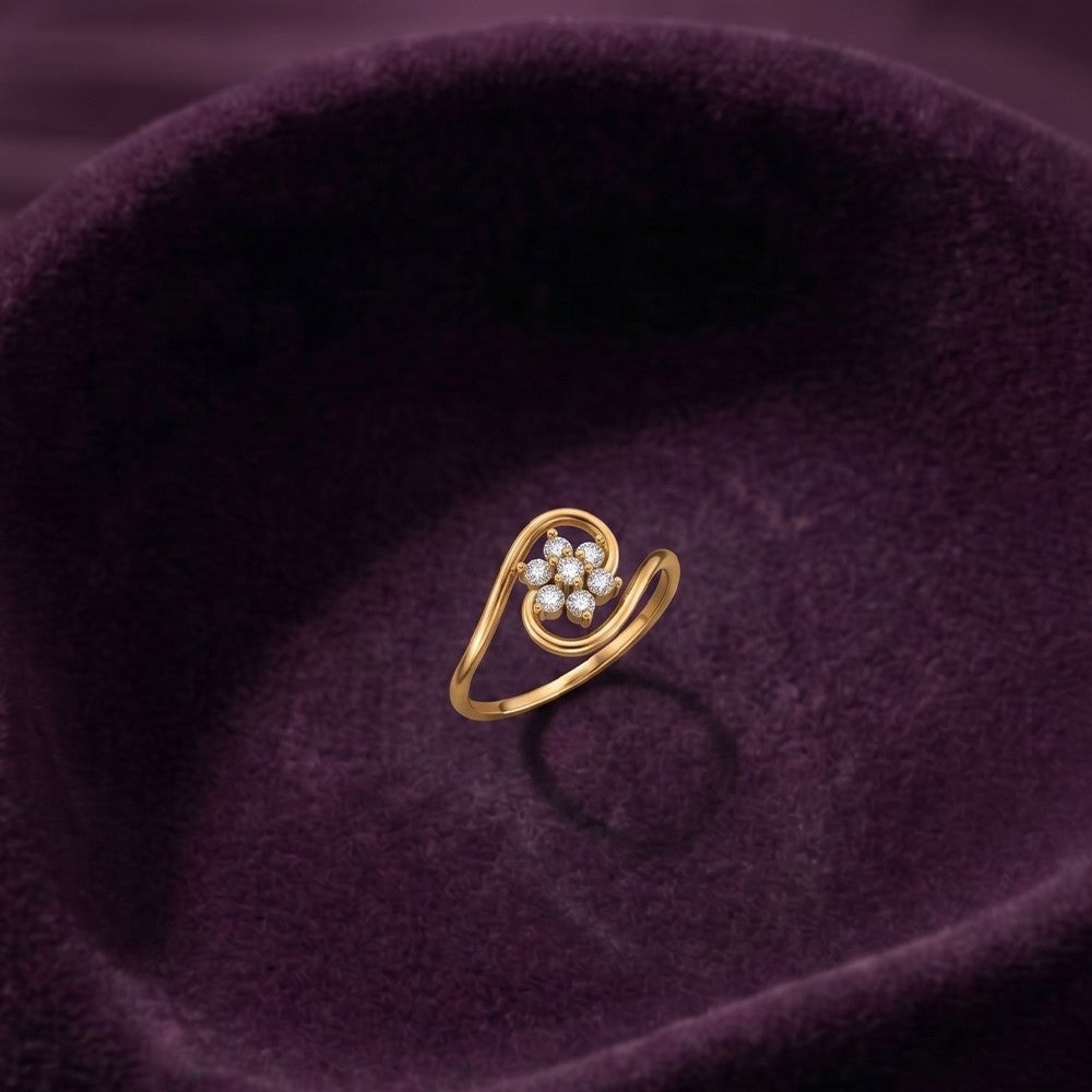 Gold and diamond with floral design on a fabric surface.