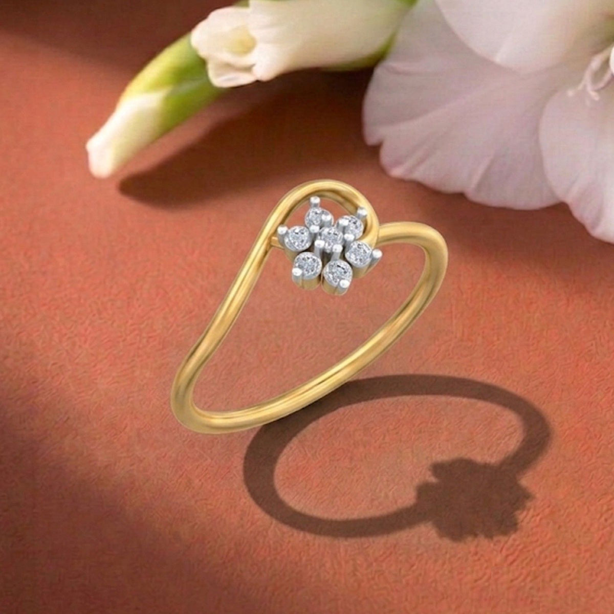 Gold and diamond with floral design on a orange surface.