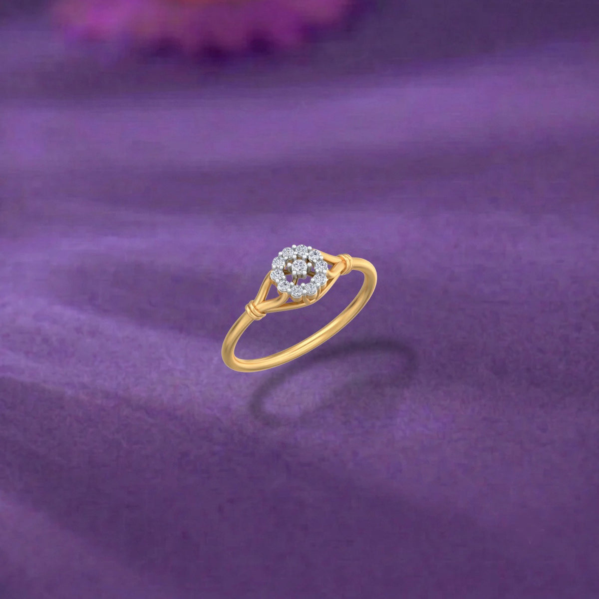 Gold and diamond with floral design on a purple surface.