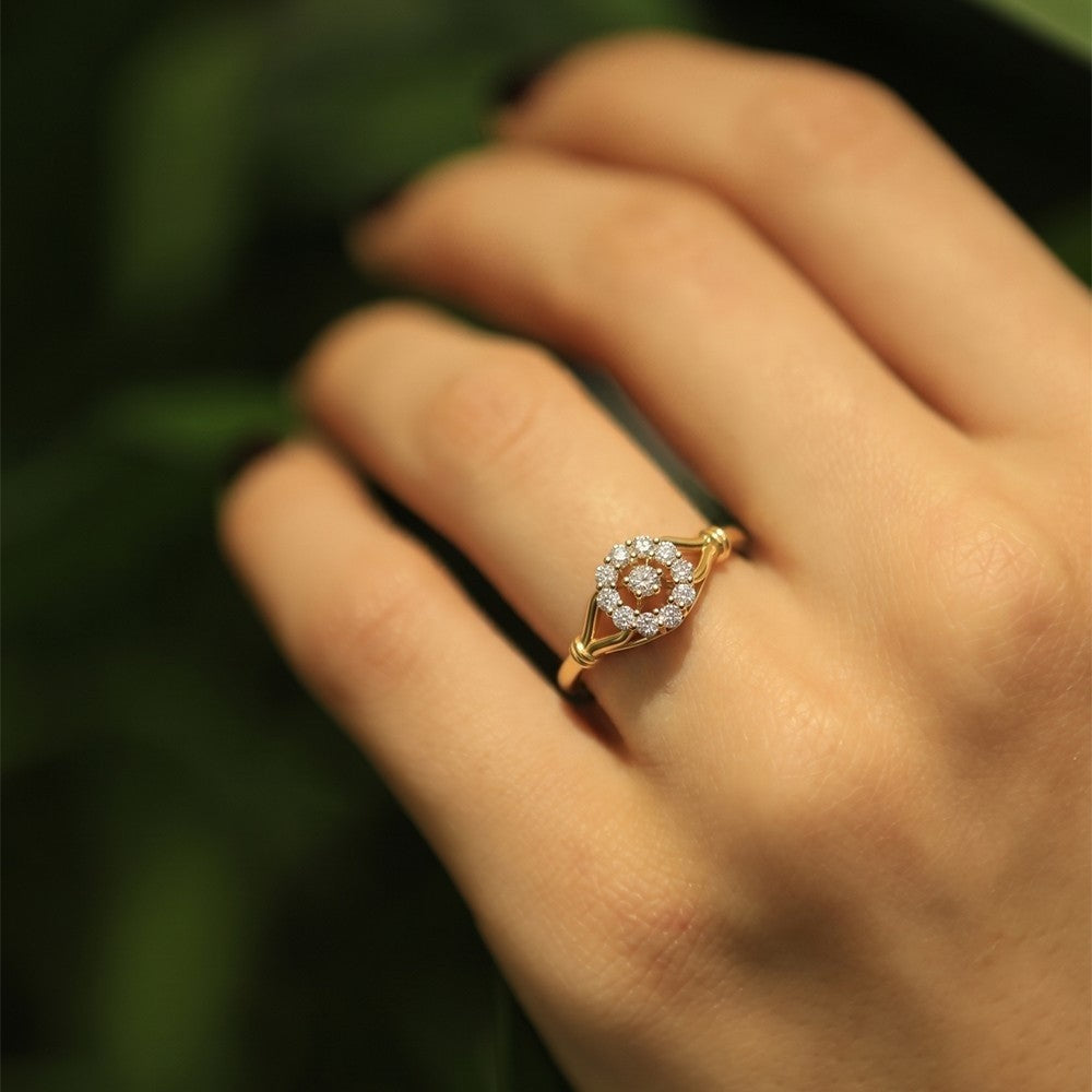 Close-up shot of a gold and diamond with floral design ring.