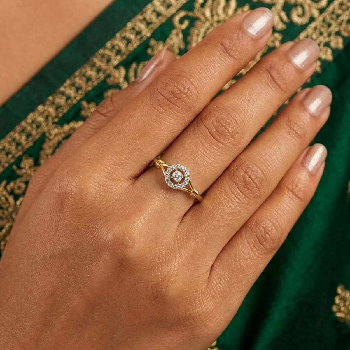Close-up shot of a gold and diamond with floral design ring.