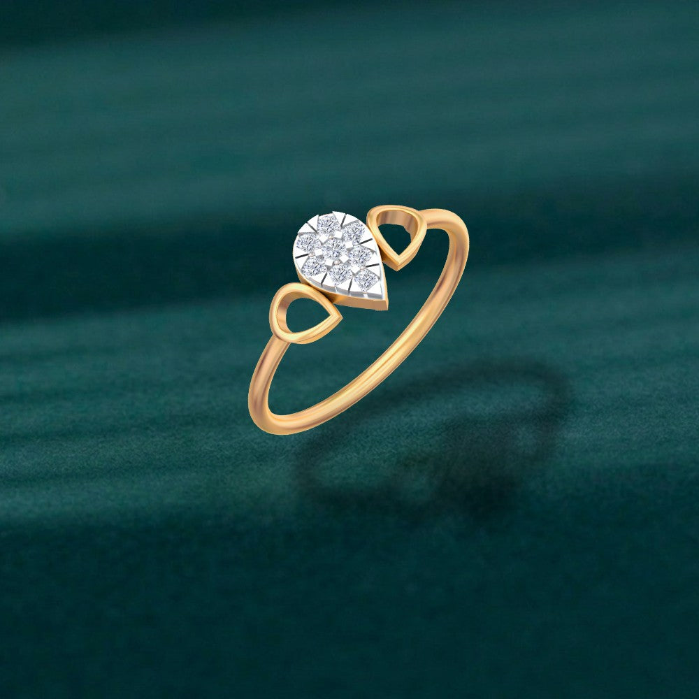 A gold ring featuring a teardrop-shaped cluster on a dark teal textured background.