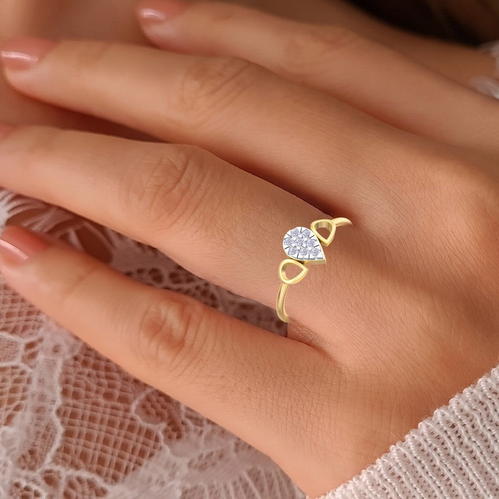 Gold ring with a diamond on a person's finger against a lace background