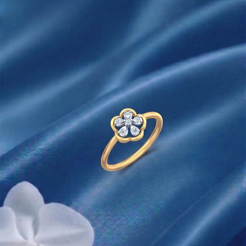 Gold and diamond with floral design on a blue satin surface.