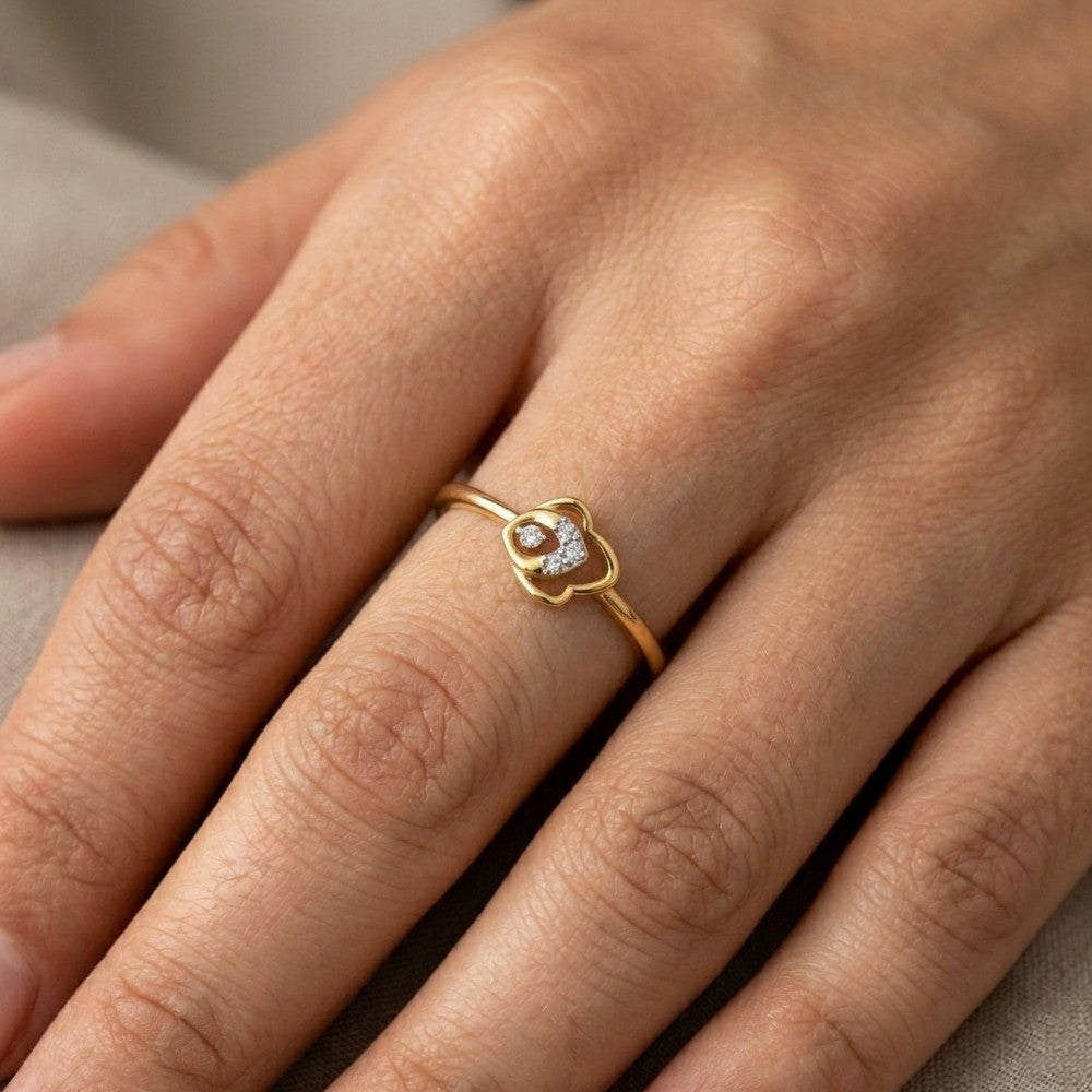 Close-up shot of a Gold and diamond with floral-design women's ring.

