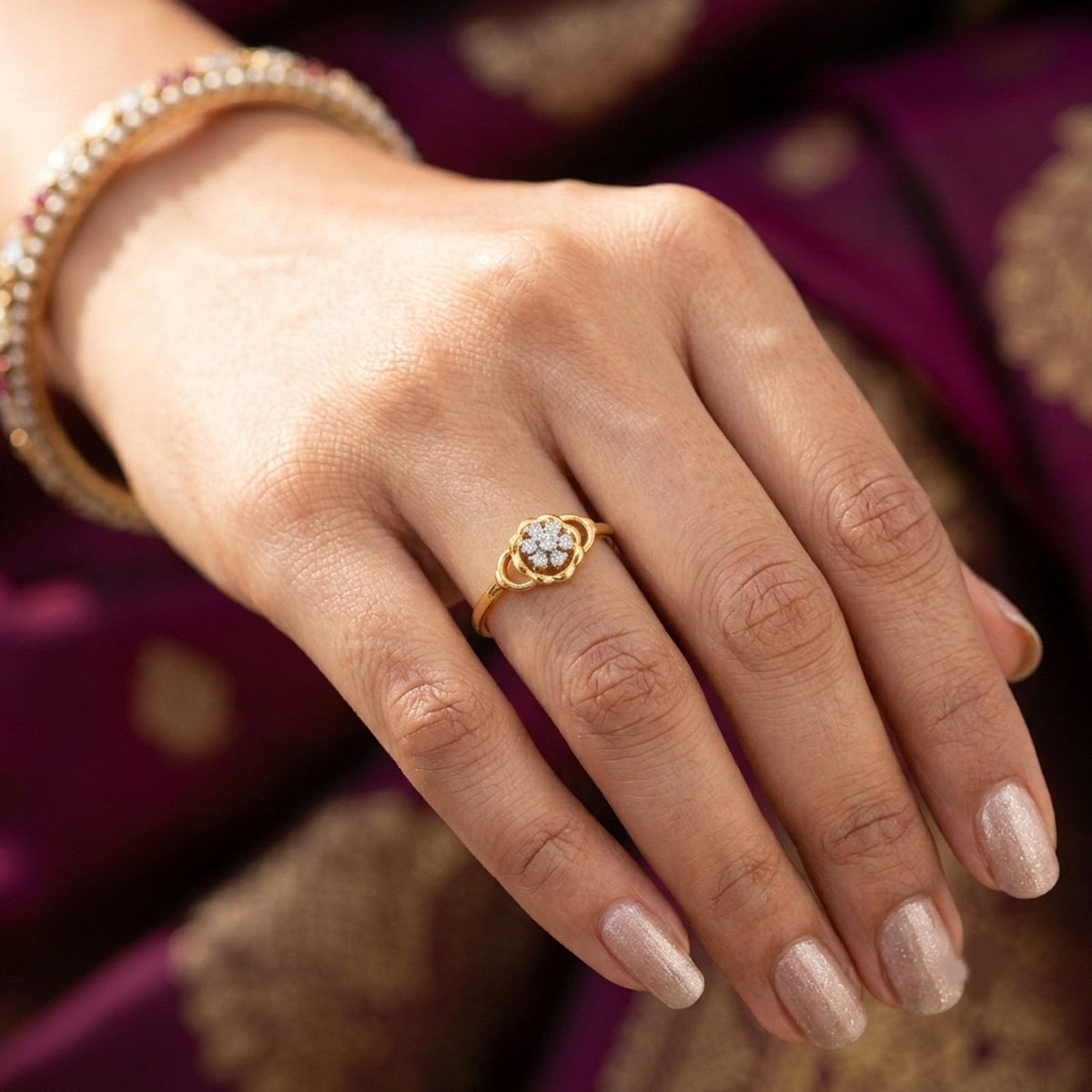 Close-up shot of a gold ring featuring a central cluster ring